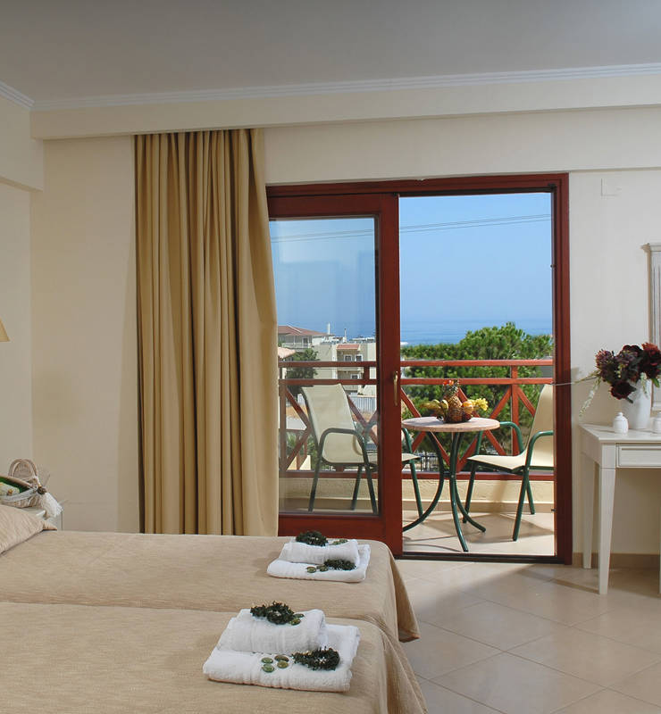 Hotel room with two beds and sea view
