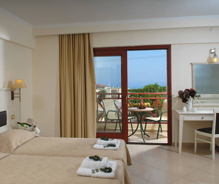 Hotel room with two beds and sea view
